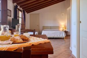 A bed or beds in a room at Poggio all'Agnello Sport & Family Holidays