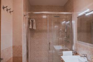 a bathroom with a shower and a sink at Poolside Hideout Apartments in Novalja