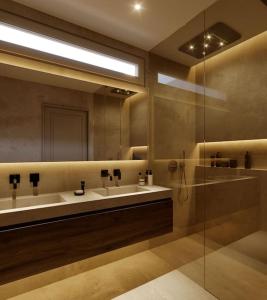 a bathroom with two sinks and a mirror at CasaKary in Seville