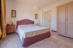 A bed or beds in a room at Poggio all'Agnello Sport & Family Holidays