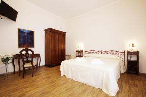 Postel nebo postele na pokoji v ubytování La Madonetta - Dimora d'epoca -