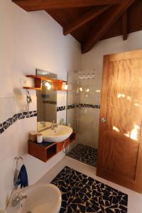 a bathroom with a sink and a toilet and a shower at L' Ancora - Room With Exclusive Pool And Terrace in Palmeira