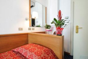 Postel nebo postele na pokoji v ubytování Hotel Sirius Riccione
