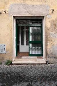an entrance to a building with a white door at Studio Flat - Lungara 44A in Rome