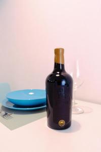 a bottle of wine sitting on top of a table at Casa Celeste in Monopoli