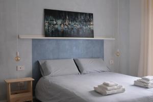 Postel nebo postele na pokoji v ubytování B&B Colori Del Lago