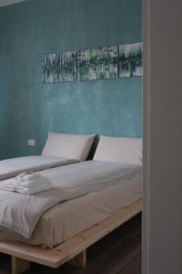 Postel nebo postele na pokoji v ubytování B&B Colori Del Lago