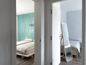 Postel nebo postele na pokoji v ubytování B&B Colori Del Lago