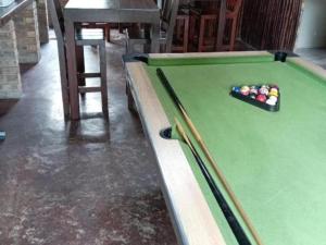 a pool table with a tray of balls on it at KWR B&B in Witbank