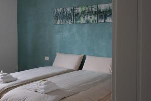 Postel nebo postele na pokoji v ubytování B&B Colori Del Lago