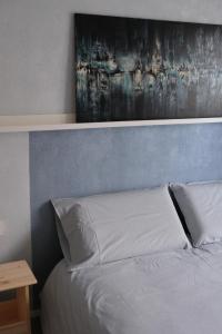 Postel nebo postele na pokoji v ubytování B&B Colori Del Lago