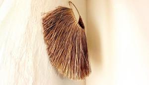 a brown and white feather hanging on a wall at Posada Puente Romano in Sedella
