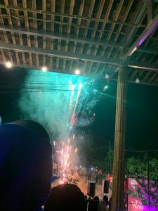 a crowd of people watching a fireworks show at night at Nhà Cổ Bản Giốc Homestay - Làng đá Khuổi Ky in Bản Piên