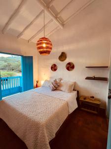 A bed or beds in a room at Casa Quintanilla Barichara