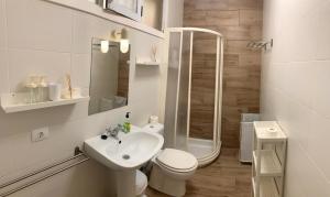 a bathroom with a toilet and a shower and a sink at Casa Susanna Apartment Costa del Silencio in Costa Del Silencio