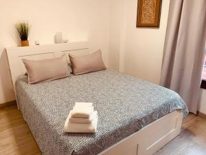 a bedroom with a bed with two towels on it at Casa Susanna Apartment Costa del Silencio in Costa Del Silencio