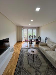 a living room with a couch and a table at Casa Maria in Beranga