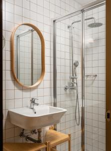 a bathroom with a sink and a shower at BYPILLOW Ramblas in Barcelona