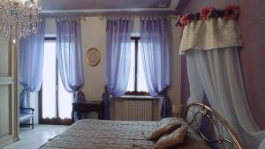 Posteľ alebo postele v izbe v ubytovaní LA CASA DEI MASUE'