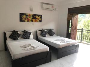 Ένα ή περισσότερα κρεβάτια σε δωμάτιο στο Sun Set Forest Villa