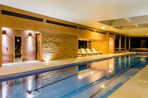a swimming pool in a house at Solar Mirador Exclusive Resort e SPA in Praia do Rosa