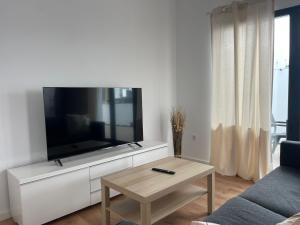 a living room with a large flat screen tv at Villa Patricia in Costa Teguise