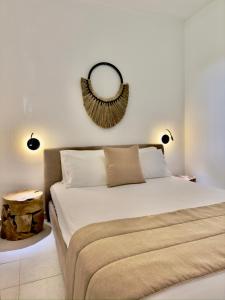 a bedroom with a bed with a mirror on the wall at Athos Blue Nikiti 1 in Nikiti