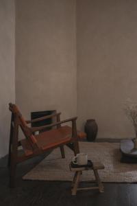 a living room with a rocking chair and a table at Loggia Studio in Edinburgh