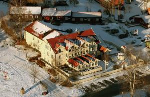 an aerial view of a large building in the snow at Seljord Hotel - Unike Hoteller in Seljord