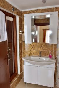 a bathroom with a sink and a mirror at MELLES OTEL in Antalya
