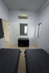 Postel nebo postele na pokoji v ubytování Andaman Residence
