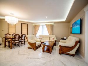 a living room with furniture and a dining room at Paradise Center Premium Suite 1 in Sofia