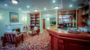 a large living room with a fireplace and a bar at Buudai hotel in Darkhan