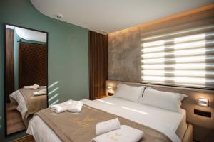 Uma cama ou camas num quarto em Hotel Flaer