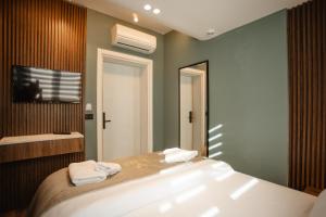 Uma cama ou camas num quarto em Hotel Flaer