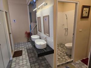 a bathroom with two sinks and a toilet at Victory place 2 (Golden Mount) in Bangkok +61 photos