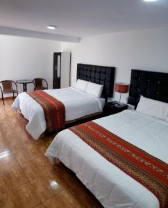 Postel nebo postele na pokoji v ubytování Cusco de mis Sueños Hostal - II