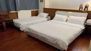 A bed or beds in a room at Sow 斯佩洛