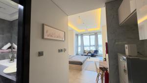 a room with a kitchen and a living room at Private Studio Burj Khalifa Area -BEST PRICE in Dubai