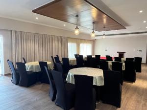 a conference room with tables and chairs in it at Narwar Lakefront Resort in Shivpurī +118 photos