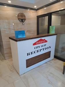 a city shuttle reception desk in a lobby at EVLAND CiTY SUiT in Adana