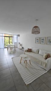 a living room with a couch and a table at Excellent apartment brand new in San Isidro