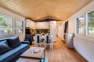 a living room with a couch and a table at Haus Zander in Lohmen