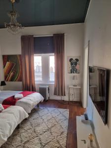 a bedroom with two beds and a window at Stockholm Central City Apartment! in Stockholm
