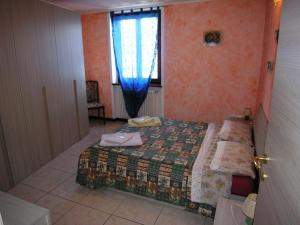 Cama ou camas em um quarto em Casa Gabriella