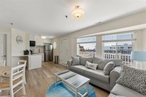 a living room with a couch and a table at 6109 Atlantic Ave, Unit 403 - The Cape Cod in Wildwood