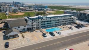 an overhead view of a building with a swimming pool at 6109 Atlantic Ave, Unit 403 - The Cape Cod in Wildwood