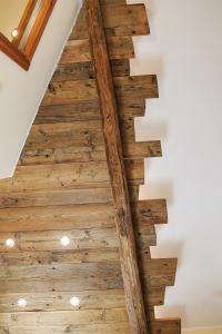 a staircase with wood flooring in a house at Le Petit Fenestrelle in Fenestrelle