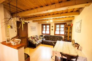 a living room with a couch and a table at Ujastraba in Východná