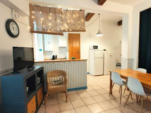 a kitchen with a table and a dining room at ca' di Rio in Riomaggiore